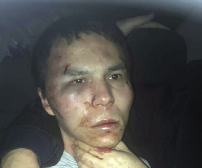 Reina club attacker after being caught by Turkish police Monday in Istanbul. Photos: Associated Press