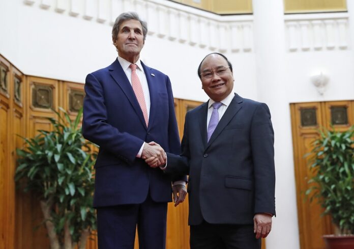 U.S. Secretary of State John Kerry, left, shakes hands with Vietnam's Prime Minister Nguyen Xuan Phuc Friday at the Office of the Government, before their meeting in Hanoi, Vietnam. Photo: Alex Brandon / Associated Press