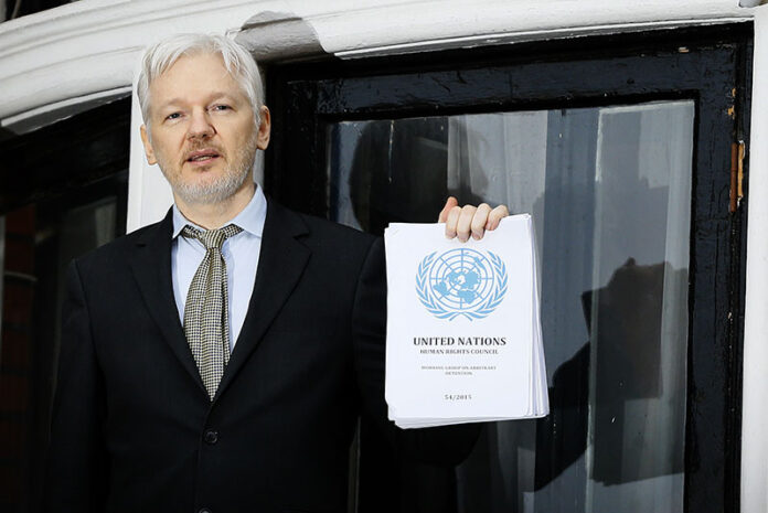 WikiLeaks founder Julian Assange speaks Feb. 5, 2016, on the balcony of the Ecuadorean Embassy in London. Photo: Kirsty Wigglesworth / Associated Press