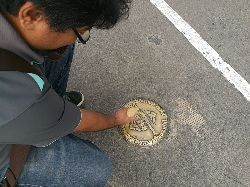 Chotisak Onsoong visits a marker Monday commemorating the 1932 revolt that ended absolute monarchy in Bangkok.