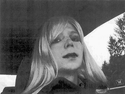 FILE - In this undated file photo provided by the U.S. Army, Pfc. Chelsea Manning poses for a photo wearing a wig and lipstick. Manning, a transgender soldier now serving 35 years at the Fort Leavenworth, Kansas military prison for leaking classified information to WikiLeaks, is asking President Barack Obama to commute her sentence to the 6 1/2 years she has already served. (U.S. Army via AP, File)