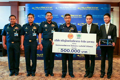 Pornperm Srisawat, in suit second from right, in an image from a CP news release.