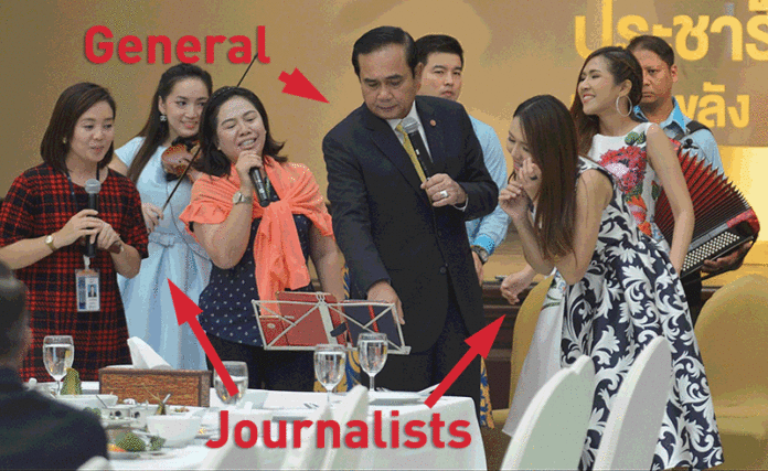 Gen. Prayuth Chan-ocha leads reporters in singing a classic pop song Sept. 15, 2016, just after an hours-long address boasting outrageously about his regime's successes at Government House in Bangkok.