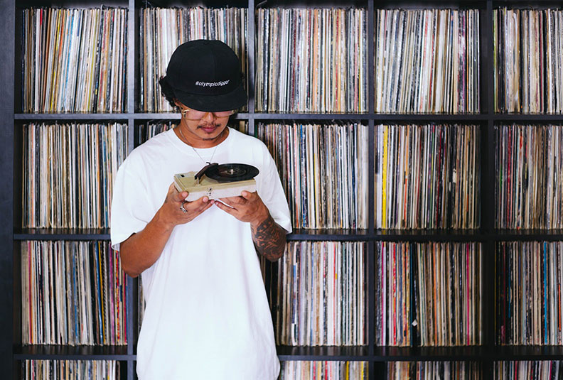 DJ Nanziee and part of his vinyl collection.