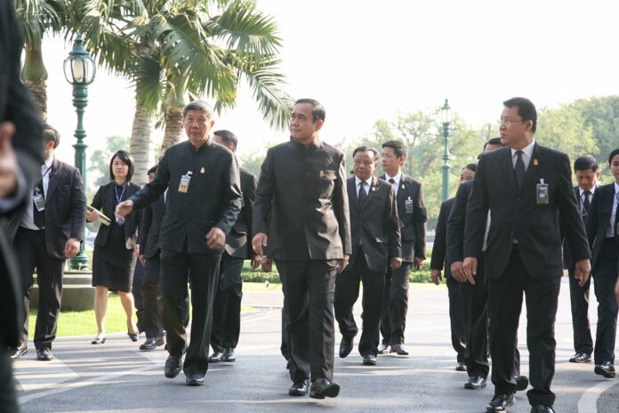 Junta chairman Prayuth Chan-ocha arrives at Government House for a Cabinet meeting Tuesday.