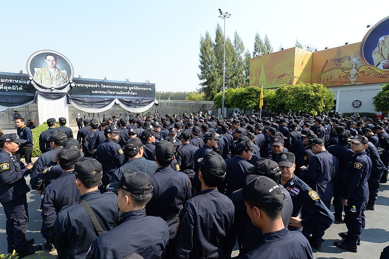 Police lined up outside the main entrance, Gate 7, to Wat Dhammkaya on Thursday afteroon in northern metro Bangkok.