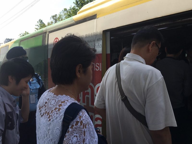 Kamhaeng Lhorketsuwan and Nantana Lhorketsuwan step aboard a BRT bus on Tuesday morning.