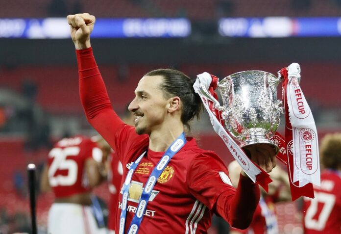 United's Zlatan Ibrahimovic celebrate with the trophy after winning the English League Cup final soccer match between Manchester United and Southampton FC, Sunday at Wembley stadium in London. Photo: Kirsty Wigglesworth / Associated Press
