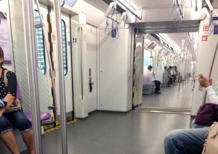 Few passengers seen Sunday on a nearly empty MRT Purple Line train.