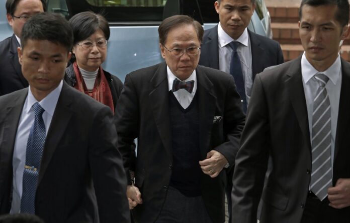 Donald Tsang, center, former leader of Hong Kong, and his wife Selina, second left, arrive Monday at Hong Kong's High Court for sentencing and mitigation after his conviction last week for misconduct in public office. Photo: Vincent Yu / Associated Press