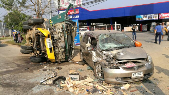 A cement truck lies on its side at the scene of an accident Wednesday that killed eight people in Chiang Rai city.