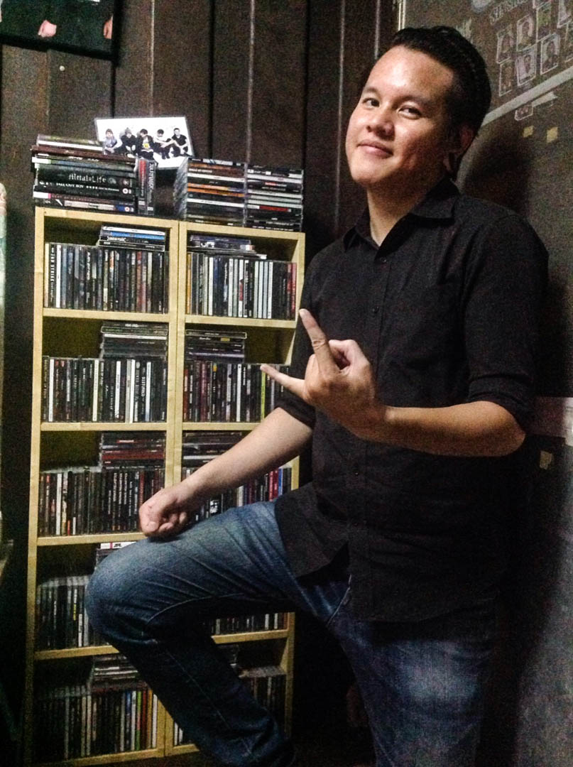Thanajed “Jed” Winaighunpong with his CD collection 