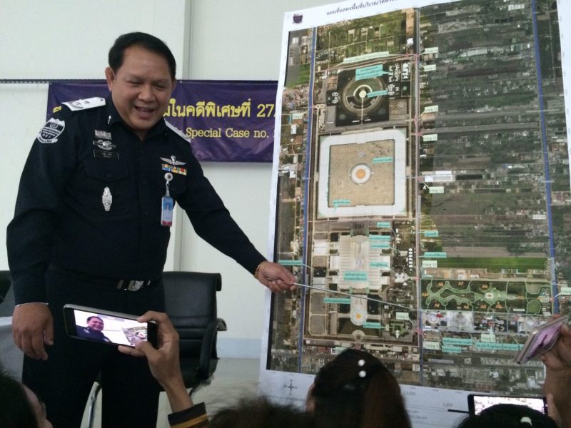 DSI spokesman Woranan Srilam briefs reporters Thursday evening at a police station near Wat Dhammakaya.