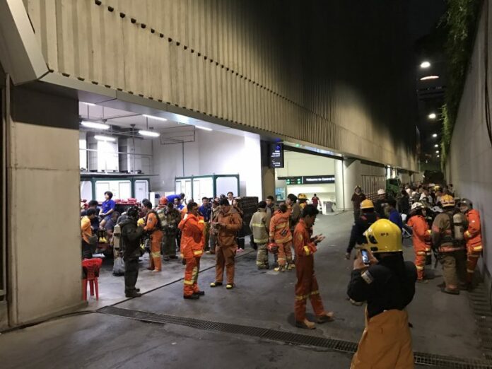 Firemen respond to the scene of a fire Thursday night at the Central Embassy shopping mall in Bangkok.