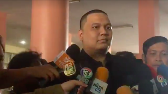 Auto racer Pai Leeke, aka Pai One Point, speaks briefly outside the Bangkok headquarters of the Narcotics Suppression Bureau. He is the latest celeb to be caught up in a widening investigation into Thai links to a suspected Lao drug lord.