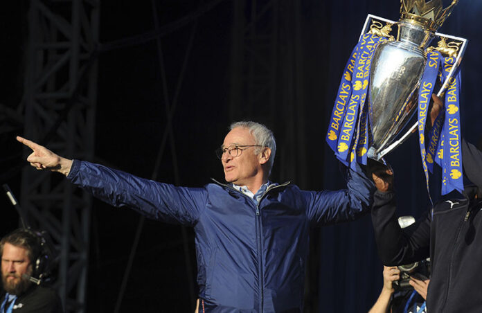 Leicester manager Claudio Ranieri shows the Premier League Trophy to fans on May 16, 2016, at Victoria Park during a victory parade to celebrate winning the English Premier league title in Leicester, England. Photo: Rui Vieira / Associated Press