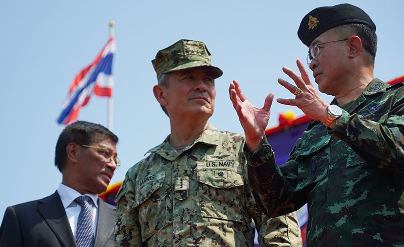 Thai Chief of Defense Forces Gen. Surapong Suwana-Adth, at right, speaks to the head of U.S. Pacific Command, Adm. Harry B. Harris, middle, at the opening ceremonies of the Cobra Gold Thai-US military exercise on Tuesday. Photo: Dake Kang / Associated Press