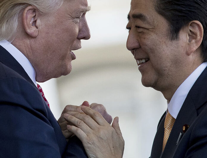 President Donald Trump on Friday welcomes Japanese Prime Minister Shinzo Abe outside the West Wing of the White House in Washington. Photo: Andrew Harnik / Associated Press