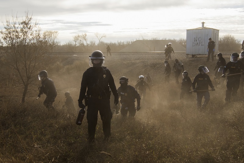 "Standing Rock" by photographer Amber Bracken which won first prize in the Contemporary Issues, Stories, category of the World Press Photo contest shows Morton County Sheriffs, riot police clear marchers from a secondary road outside a Dakota Access Pipeline (DAPL) worker camp using rubber bullets, pepper spray, tasers and arrests. Photo: Amber Bracken / Associated Press