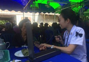 An undated photo of Sangduen Longta offering a free health check-up to attendees at a funeral in Chiang Mai. Photo: Sangduen Longta / Facebook