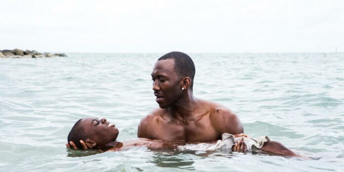 Alex Hibbert, left, and Mahershala Ali in a scene from the film,