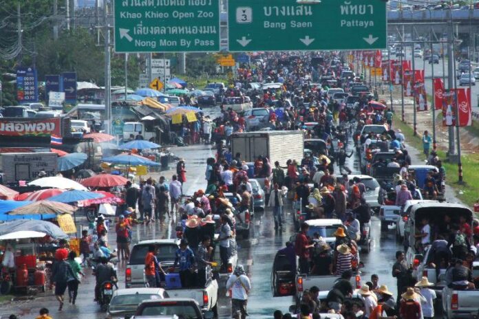 Revelers and motorists engage in a Songkran water fight on April 16, 2011, on Sukhumvit Road in Chonburi province.