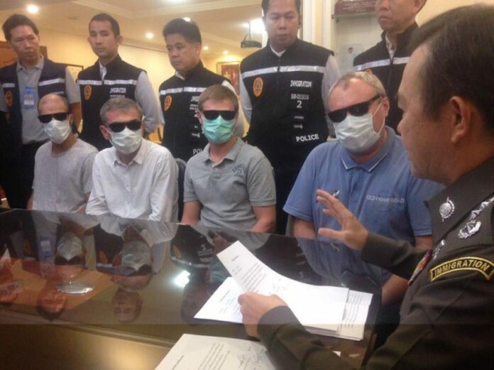 From left, organized crime suspects Amine Chanekar of Morocco and Russians Mikhail Kriventcov, Anton Filippov and Aleksandr Danilov at a police news conference Monday in Pattaya.