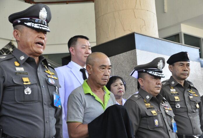 Former palace official and police commander Jumpol Manmai is brought to Nakhon Ratchasima provincial court March 2 for his remand hearing.