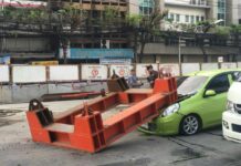 Elevated Rail Structure Falls on Car; Narrowly Misses Woman