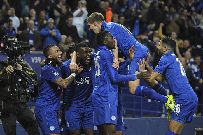 Leicester's Wes Morgan, second left, celebrates with team mates after he scores a goal during the Champions League round of 16 second leg soccer match between Leicester City and Sevilla on Tuesday at the King Power Stadium in Leicester, England. Photo: Rui Vieira / Associated Press