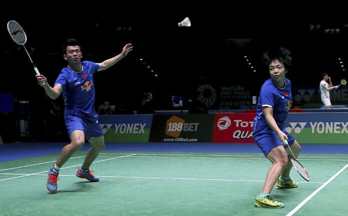 China's Zheng Siwei, at left, and Chen Qingchen in action during round one of the Mixed Doubles against Thailand's Dechapol Puavaranukroh and Sapsiree Taerattanachai on Wednesday, day two of the All England Open Badminton Championships at the Barclaycard Arena, Birmingham. Photo: Simon Cooper / PA
