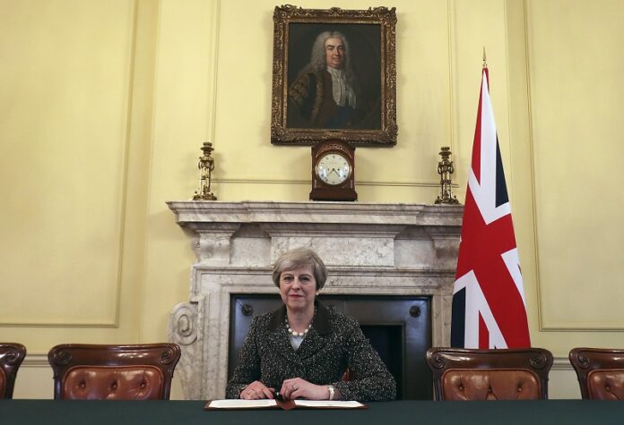 Britain's Prime Minister Theresa May sits below a painting of the country's first Prime Minister Robert Walpole in 2017 in 10 Downing Street, London. Photo: Christopher Furlong / Associated Press Britain's Prime Minister Theresa May sits below a painting of the country's first Prime Minister Robert Walpole in 2017 in 10 Downing Street, London. Photo: Christopher Furlong / Associated Press