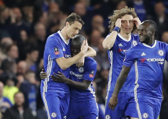 Chelsea players celebrate after Chelsea's N'Golo Kante, 2nd left, scored the opening goal during the English FA Cup quarterfinal soccer match between Chelsea and Manchester United on Monday at Stamford Bridge stadium in London. Photo: Frank Augstein / Associated Press