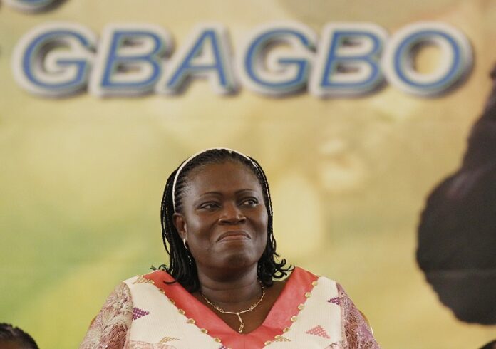 Simone Gbagbo, wife of Laurent Gbagbo, smiles during a pro-Gbagbo rally in 2011 at the Palace of Culture in the Treichville neighborhood of Abidjan, Ivory Coast. Photo: Rebecca Blackwell / Associated Press