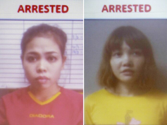 Photos released by Royal Malaysia Police shows detained Indonesian suspect Siti Aisyah, left, and detained Vietnamese suspect Doan Thi Huong are displayed on a screen during a press conference in February at the Bukit Aman national police headquarters in Kuala Lumpur, Malaysia. Photo: Associated Press