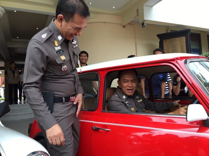 Bangkok police chief Lt. Gen. Sanit Mahathavorn sits in a car that was seized with fake plates Feb. 25 at the Metropolitan Police Headquarters.
