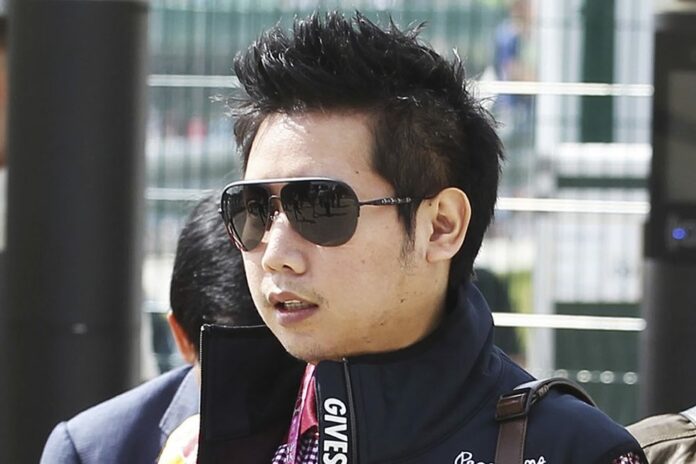 Vorayuth 'Boss' Yoovidhya, who has evaded justice for years in the death of a Thonglor police officer, spotted in 2013 at the British Formula 1 Grand Prix in Silverstone, England, in a photo provided by XPB Images. Photo: XPB Images / AP