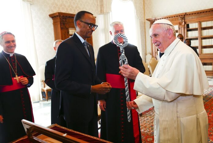 Pope Francis, right, and Rwanda's President Paul Kagame exchange gifts during a private audience Monday at the Vatican. Photo: Tony Gentile / Associated Press