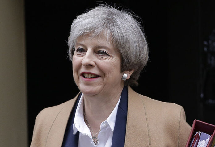 Britain's Prime Minister Theresa May leaves 10 Downing Street on her way to parliament, London, in a March 29, 2017, file photo. May is due to make an unexpected statement in Downing Street on Tuesday. Photo: Alastair Grant / Associated Press