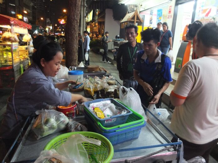 A street vendor sells goods from her stall in March in Thonglor. Photo: Sasiwan Mokkhasen