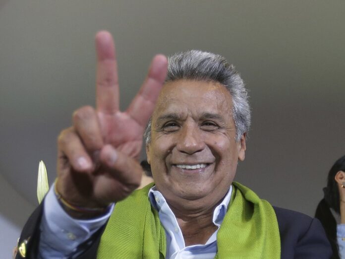 Alianza PAIS's presidential candidate Lenin Moreno flashes a victory sign at the end of the day of the presidential election, Sunday in Quito, Ecuador, Sunday. Photo: Dolores Ochoa / Associated Press
