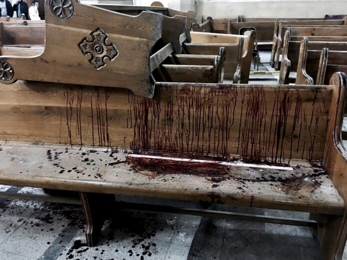 Blood stains pews inside the St. George Church after a suicide bombing, Sunday in the Nile Delta town of Tanta, Egypt. Photo: Nariman El-Mofty / Associated Press