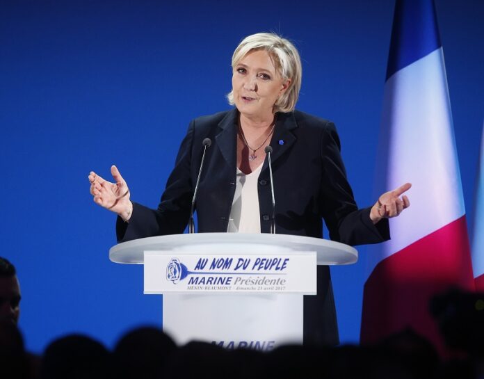 Far-right leader and candidate for the 2017 French presidential election, Marine Le Pen, addresses supporters Sunday after exit poll results of the first round of the presidential election were announced at her election day headquarters in Henin-Beaumont, northern France. Photo: Michel Spingler / Associated Press