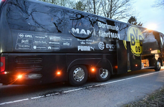 A window of Dortmund's team bus is damaged after an explosion before the Champions League quarterfinal soccer match between Borussia Dortmund and AS Monaco in Dortmund, western Germany, Tuesday. Photo: Martin Meissner / AP.