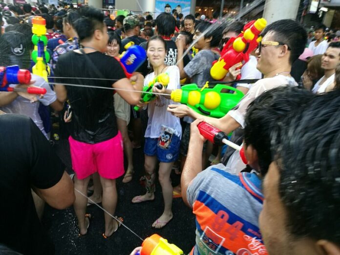 Revellers celebrate the last day of Songkran last year in Silom.