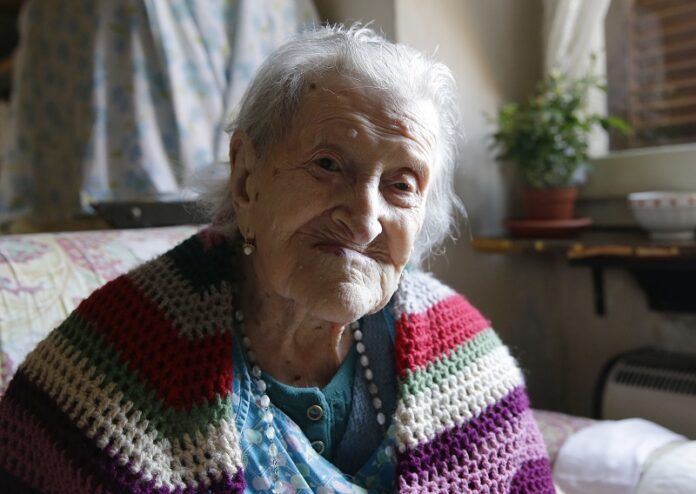 Emma Morano sits in her apartment in 2015 in Verbania, Italy. Photo: Antonio Calanni / Associated Press