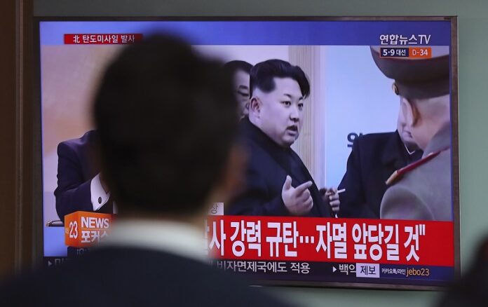A man watches a TV news program showing a file footage of North Korean leader Kim Jong Un, Wednesday at Seoul Train Station in Seoul, South Korea. Photo: Lee Jin-man / Associated Press