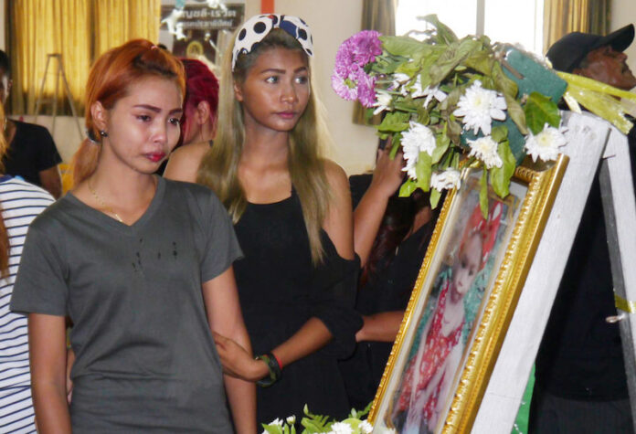 Chiranut Trairat, mother of an 11-month-old baby girl, cry in front of her daughter's portrait before funeral in Phuket, Thailand, April 29. Photo: AP.