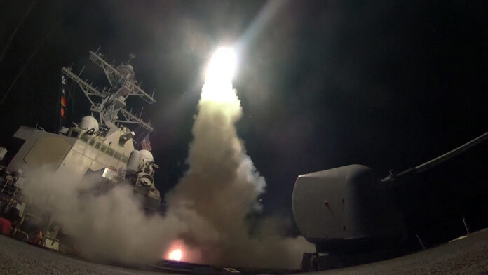 In this image provided by the U.S. Navy, the guided-missile destroyer USS Porter launches a tomahawk land attack missile in the Mediterranean Sea, on Friday. Photo: Mass Communication Specialist 3rd Class Ford Williams / U.S. Navy / Associated Press