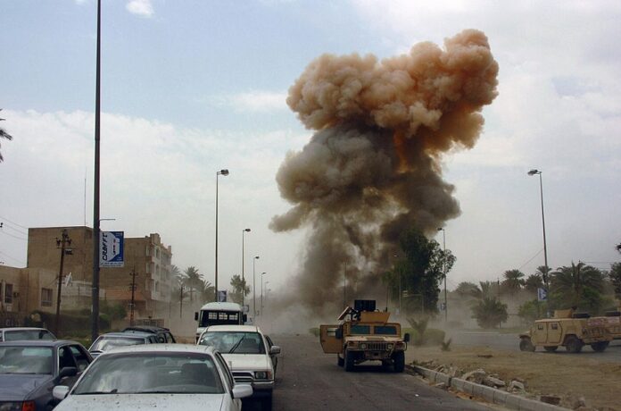 The aftermath of a car bombing in 2005 in Baghdad, Iraq. Photo: Ronald Shaw Jr. / Wikimedia Commons